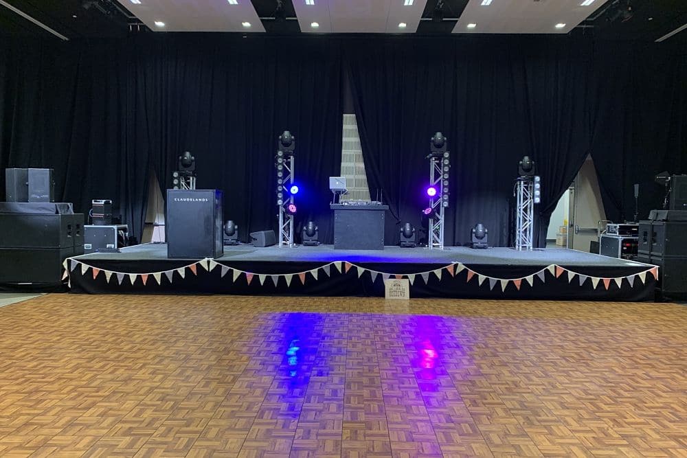 A DJ equipment set up in the Heaphy Function Room at Claudelands - Large dance floor in front of stage