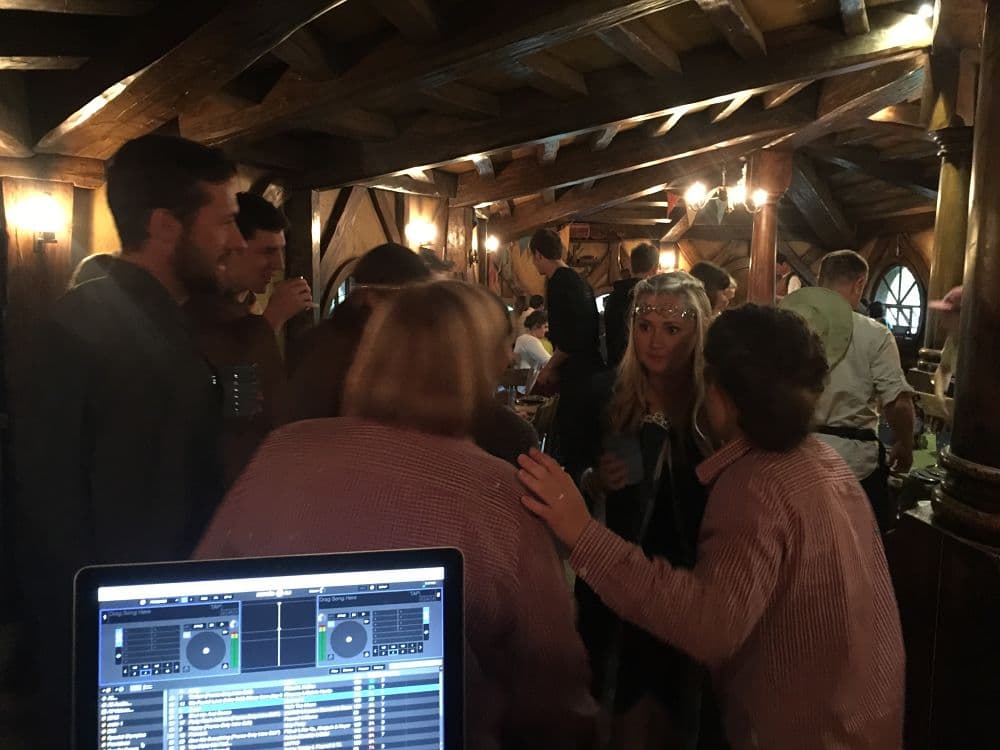 Hobbiton Green Dragon Inn - Corporate party guests drinking next to bar