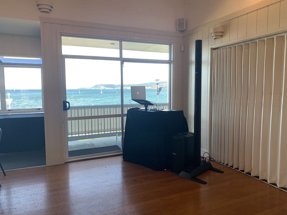 Lake Taupo Yacht Club - DJ equipment set up in corner with lake view
