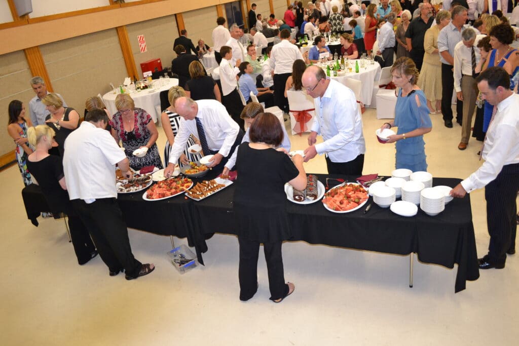 Matamata Civic Centre - Wedding guests selecting food from buffet