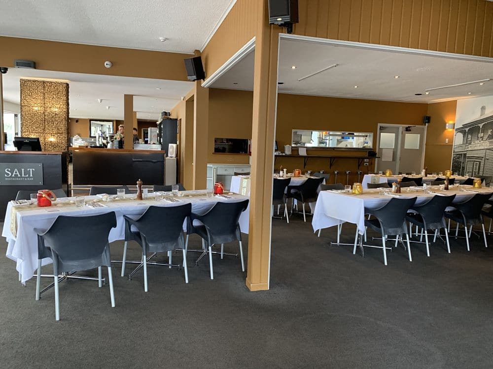 Salt Restaurant and Bar​ - Tables set up for a wedding reception next to bar