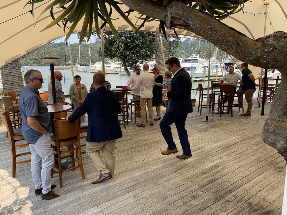 Salt Restaurant and Bar​ - wedding guests having pre drinks on the waterside deck