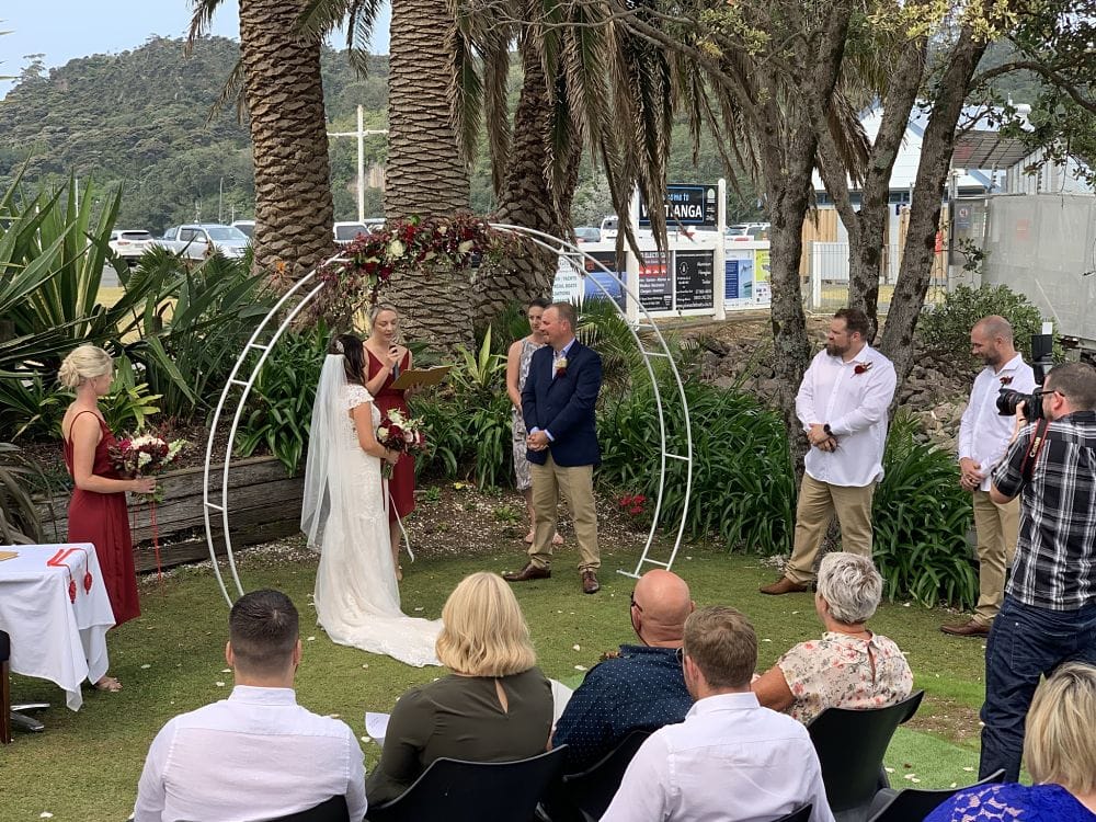 Salt Restaurant and Bar​ - Wedding ceremony on lawn below deck, wedding celebrant talking to guests