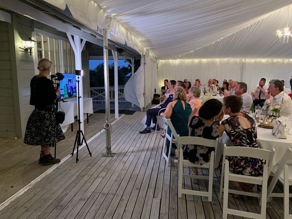 Huka Falls Resort - Wedding guests watching video of guests from overseas