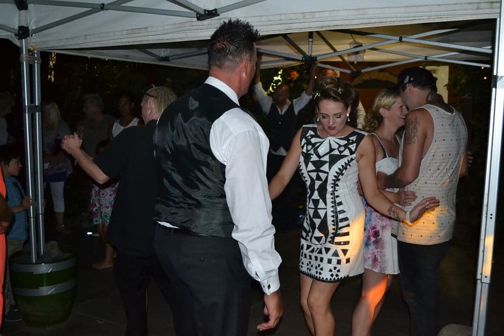 The Metcalfes Huntly - Wedding guests dancing on patio