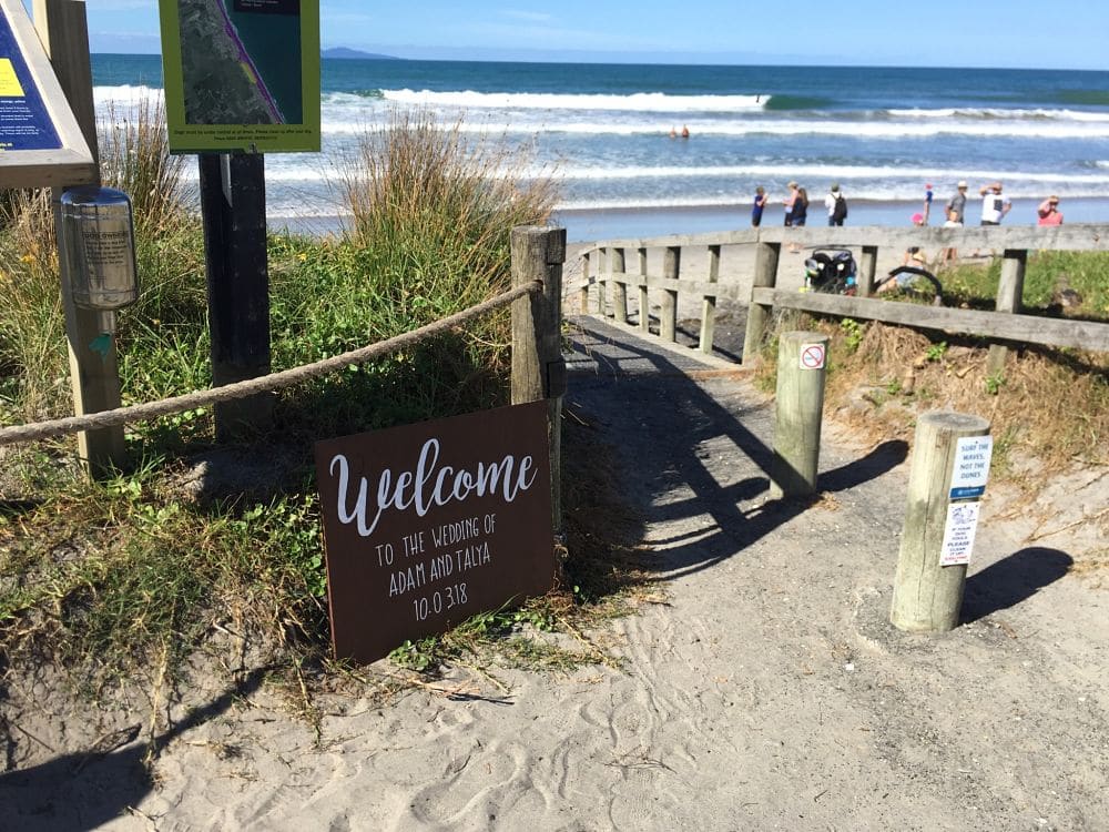 Waihi Beach - Wedding Welcome sign on path to beach
