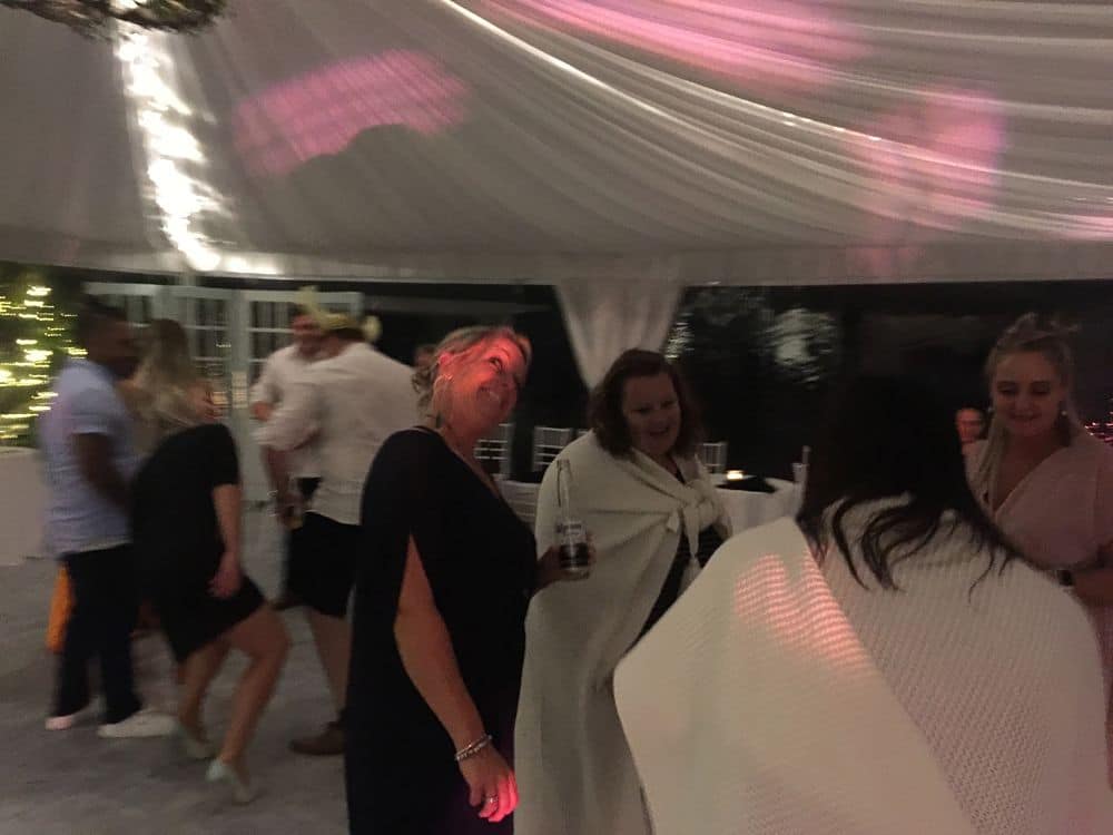 Olive Tree Cottage Tauranga - Wedding Guests Dancing Smiling and Drinking