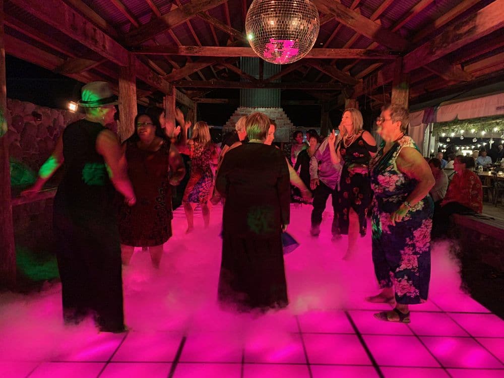 Poronui Lodge - Guests dancing on retro disco floor with dry ice effect