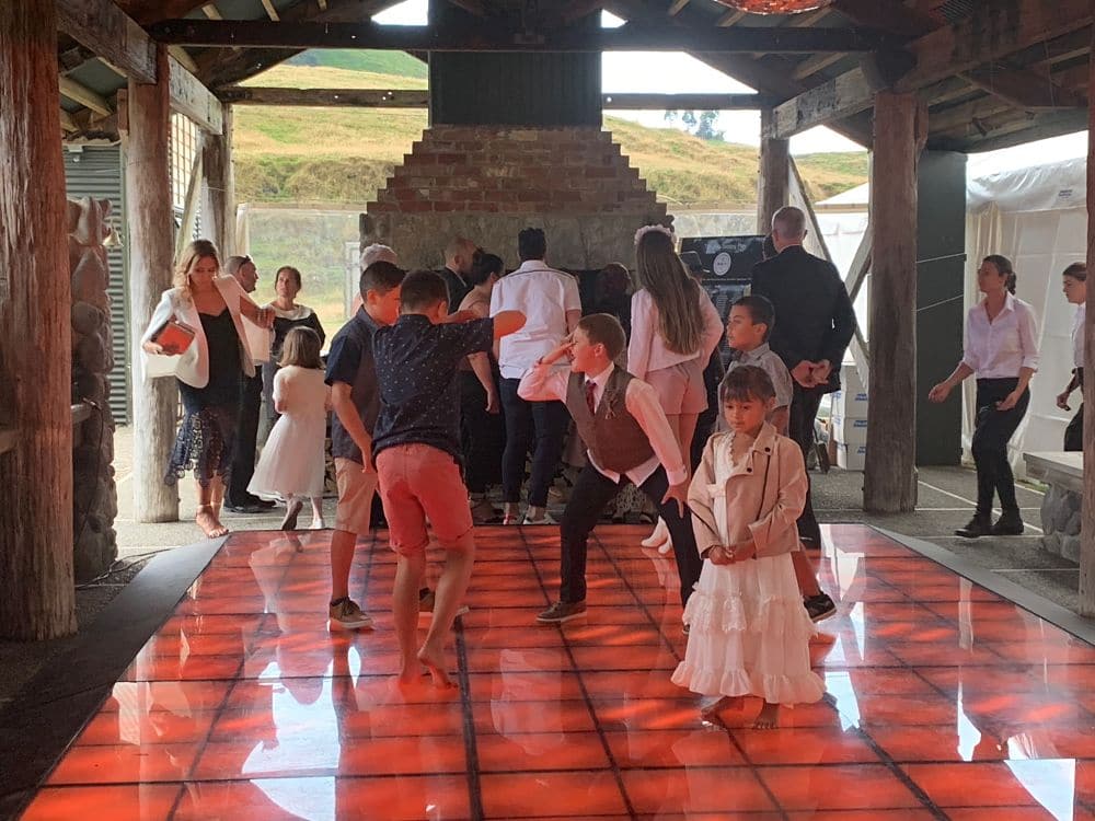Poronui Lodge - Kids dancing during the early evening at a wedding reception in The Stables