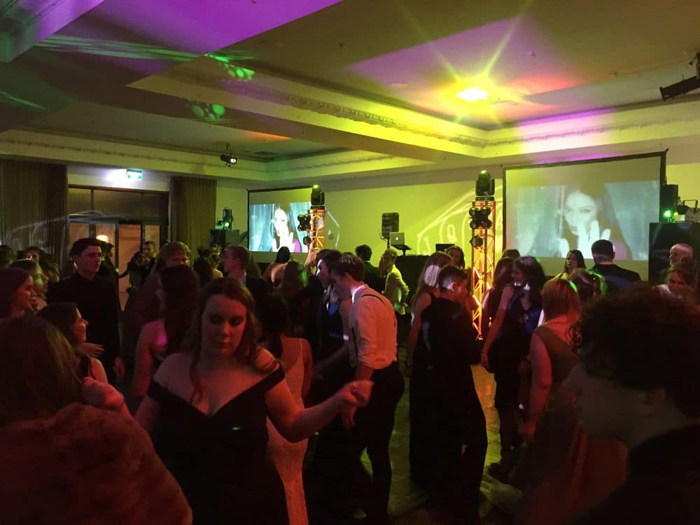 The Distinction Hotel Palmerston North - Guest dancing in front of DJ with two big video screens
