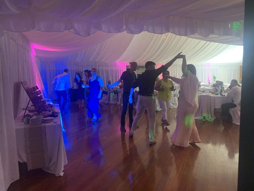 Guests dancing at a wedding reception held in Newbury Hall Palmerston North