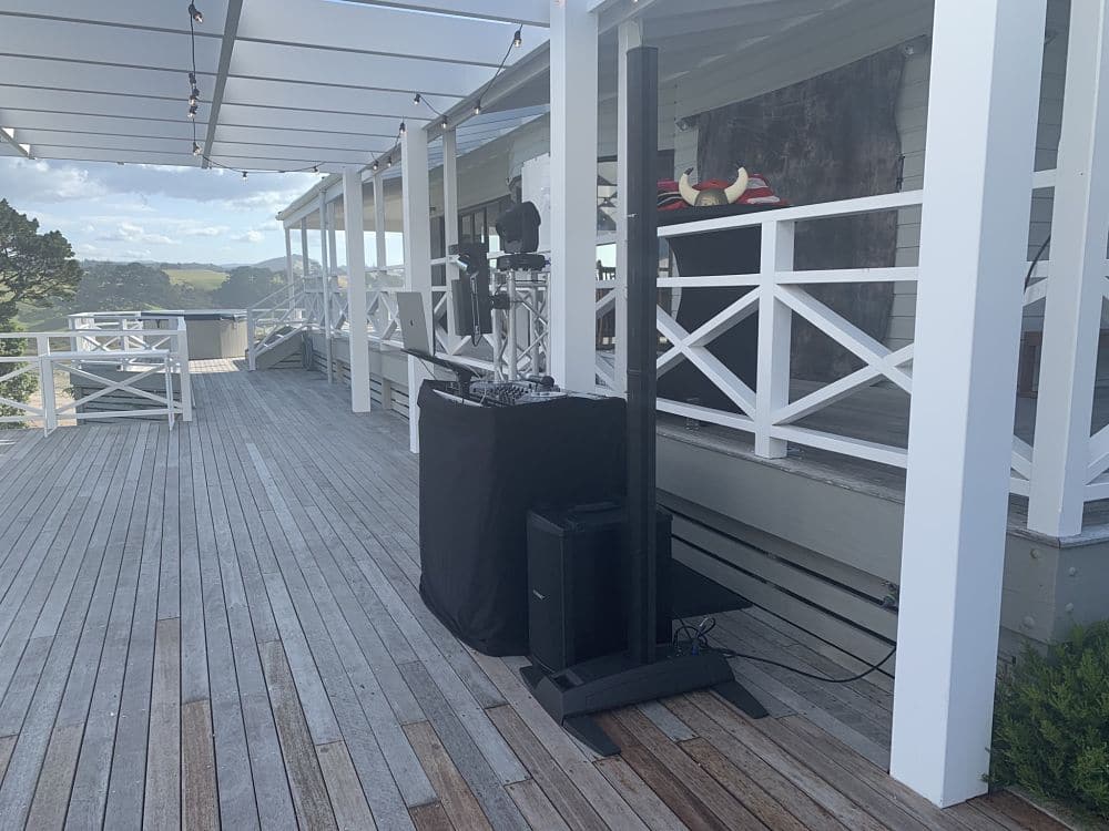 Orua Beach House - DJ equipment set up on deck for a wedding reception