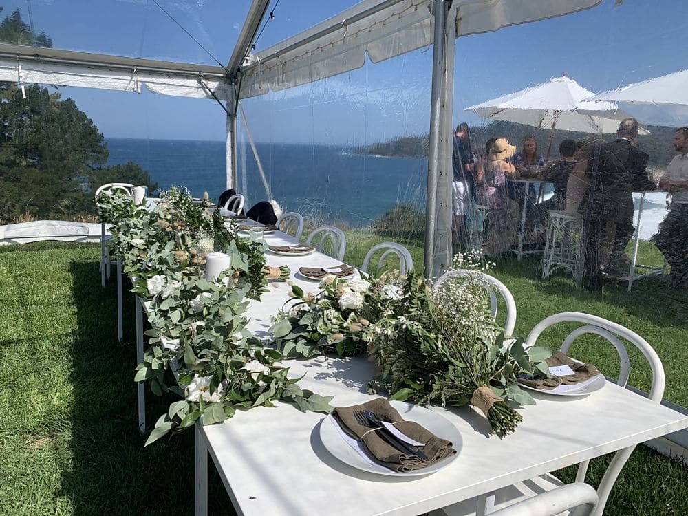 Orua Beach House - Bridal Party table setting in Marquee