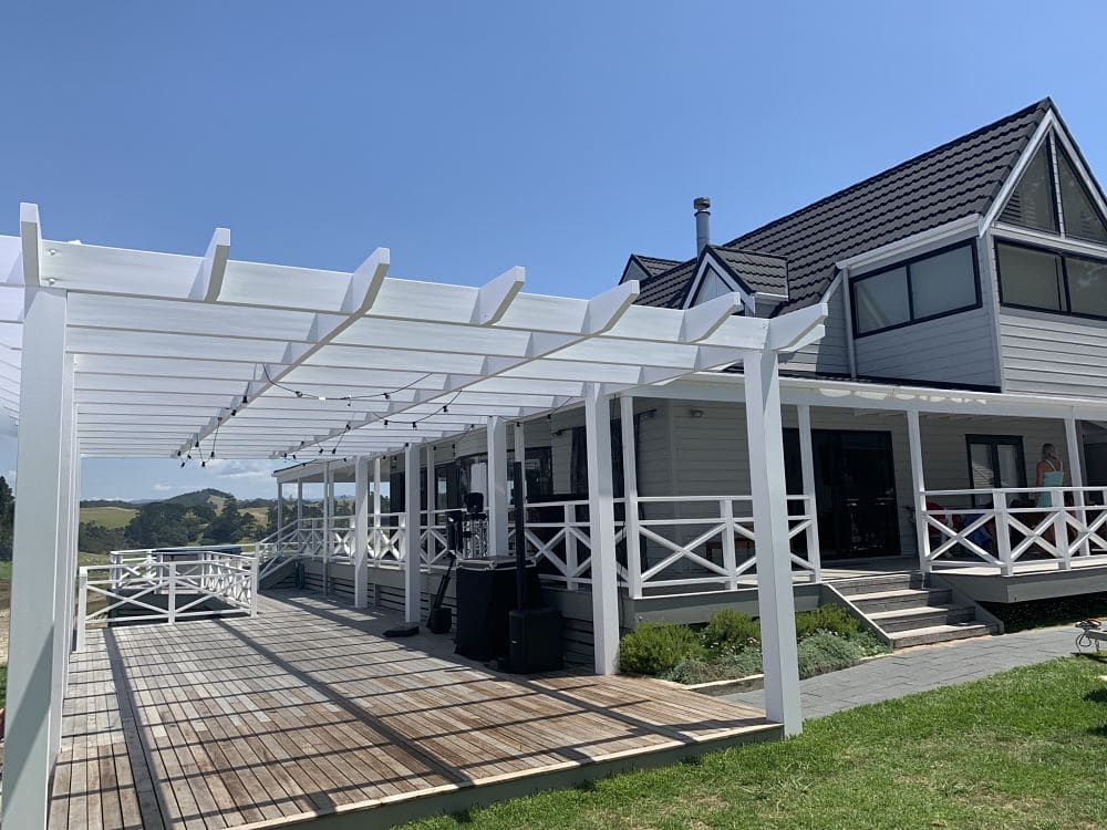 Orua Beach House - Deck featuring Pergola and DJ equipment set up ready to party