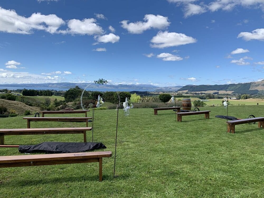 Tironui Wedding Venue Rotorua - Ceremony seating outside with view of Rotorua City and Lake